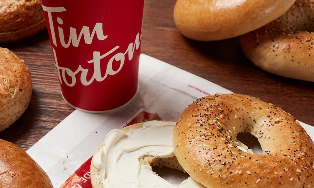 Photo of Tim Hortons bagels with cream cheese and a red coffee cup