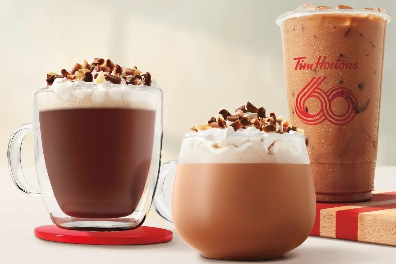 Photo of Tim Hortons winter hot chocolate drinks topped with whipped cream and chocolate shavings
